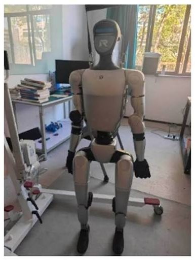 Humanoid robot resting in a workshop between bookings