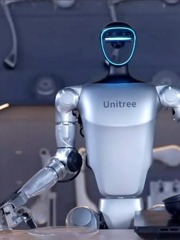 A Unitree humanoid gripping a pan with its articulated hand